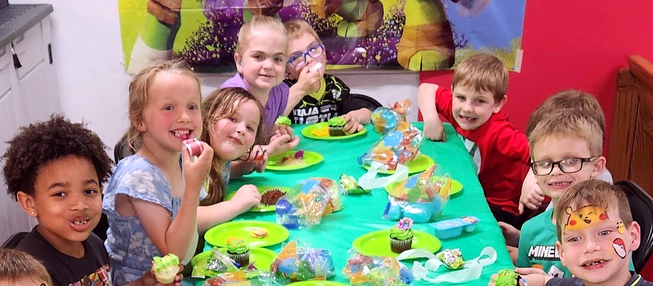 Kids smiling with cupcakes at a birthday party at Integrity Martial Arts — Milton, WI